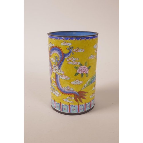 10 - A Canton enamel brush pot with dragon and phoenix decoration, 4 character mark to base, 5