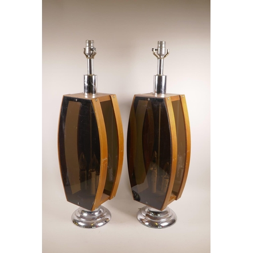 1171 - A pair of mid century teak and smoked perspex lamps, 29½