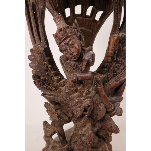 16 - A 1940s Balinese hard wood carving of Vishnu riding Garuda, beautifully carved, A/F, 15