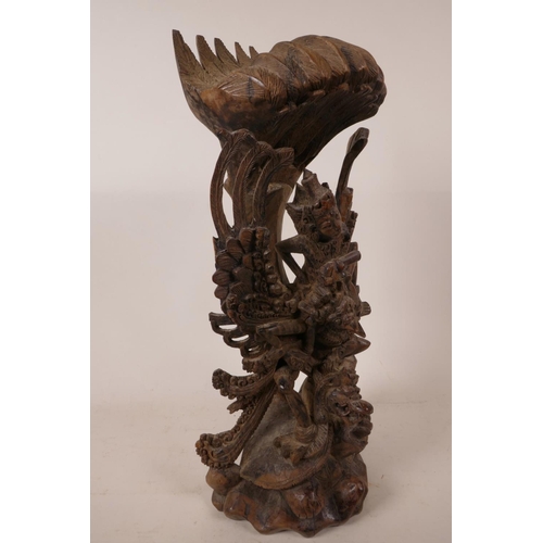 16 - A 1940s Balinese hard wood carving of Vishnu riding Garuda, beautifully carved, A/F, 15