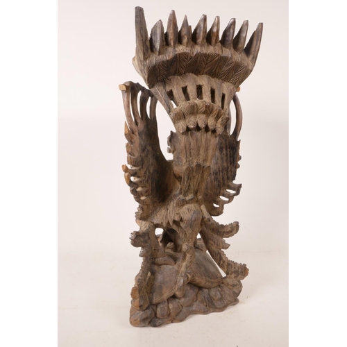 16 - A 1940s Balinese hard wood carving of Vishnu riding Garuda, beautifully carved, A/F, 15