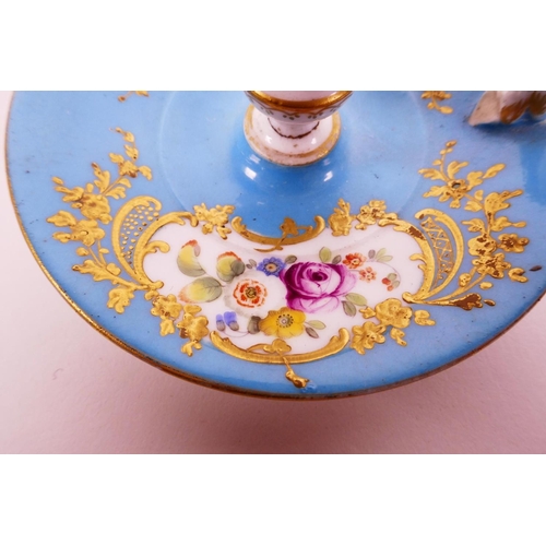 22 - A C18th Sevres bleu celeste (turquoise blue) ground chamberstick, hand painted with polychrome flowe... 