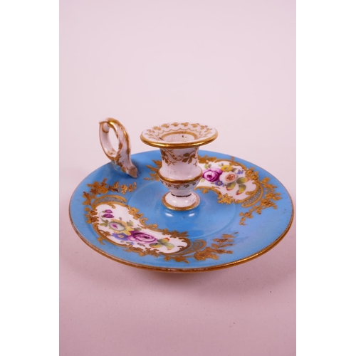 22 - A C18th Sevres bleu celeste (turquoise blue) ground chamberstick, hand painted with polychrome flowe... 