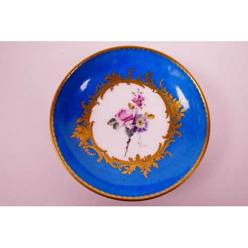 22 - A C18th Sevres bleu celeste (turquoise blue) ground chamberstick, hand painted with polychrome flowe... 