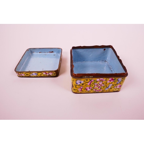 23 - A C19th Cantonese square enamel box with cover, decorated with flowers, motifs and scrolls on a yell... 