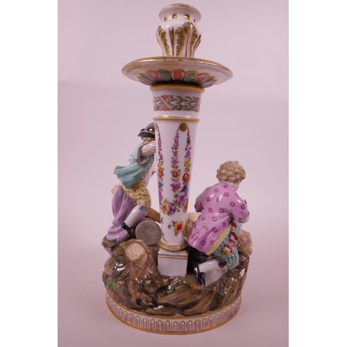 29 - A C19th porcelain figural group, with the crossed swords Meissen blue mark beneath, modelled with a ... 