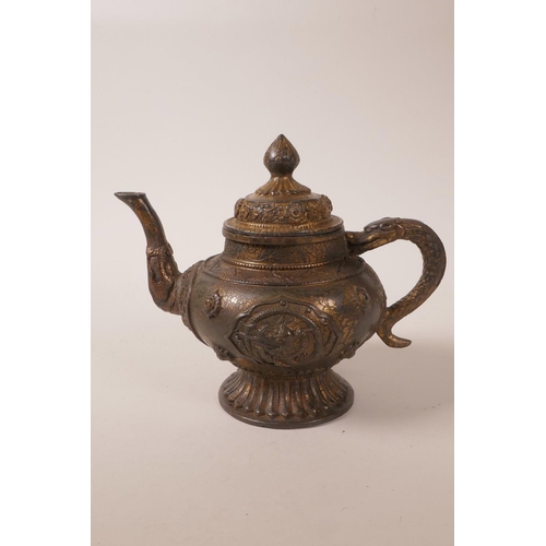 35 - A Chinese gilt and bronzed metal teapot with raised dragon and floral decoration, mark to base, 6½