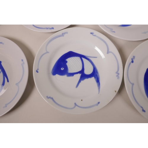 38 - A set of eight Oriental blue and white porcelain side plates decorated with fish, 8