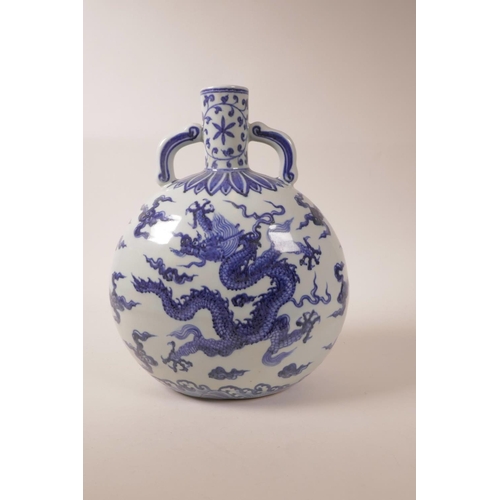 40 - A large Chinese blue and white pottery two handled moon flask with dragon decoration, 6 character ma... 