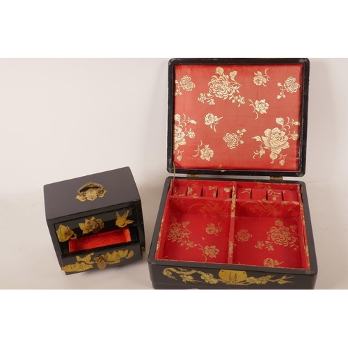 67 - An Oriental lacquered jewellery box decorated with birds and flowering branches, 9½