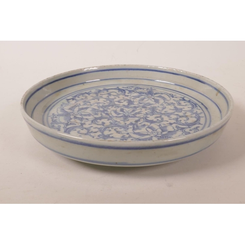 68 - A Chinese blue and white porcelain shallow dish with scrolling lotus flower decoration, 7½