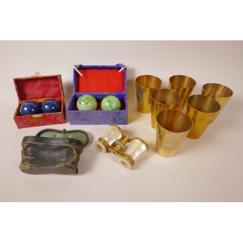 71 - A pair of brass and mother of pearl opera glasses (cased), together with a set of six engraved brass... 