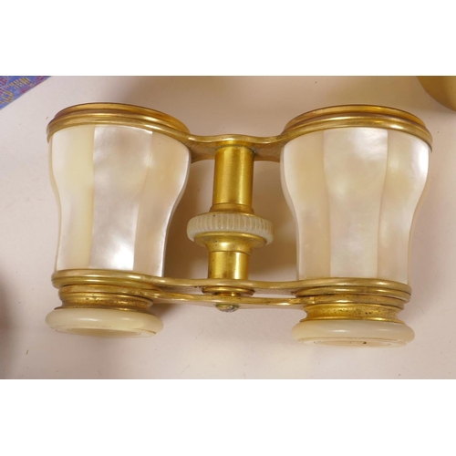 71 - A pair of brass and mother of pearl opera glasses (cased), together with a set of six engraved brass... 