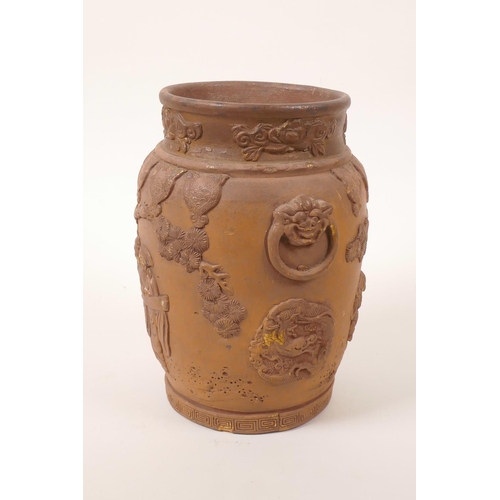 35 - A Chinese earthenware jar with raised decoration of a figure and dragon, A/F losses and chips, 7