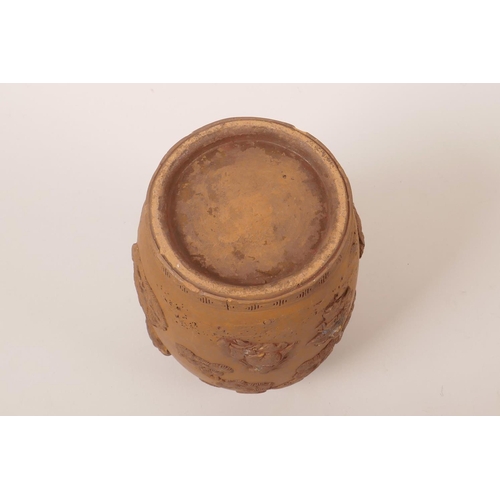 35 - A Chinese earthenware jar with raised decoration of a figure and dragon, A/F losses and chips, 7