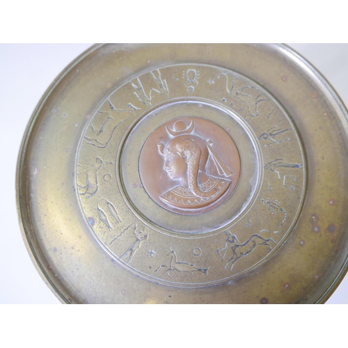 54 - A French Art Deco  brass and copper tazza, the top with engraved zodiac figures and a central copper... 