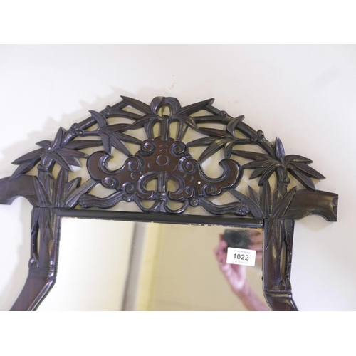 1171 - A Chinese pagoda shaped, carved hardwood frame wall mirror, with pierced decoration of bamboo and ba... 