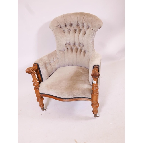 1180 - A C19th walnut show frame armchair with scrolled arms and serpentine front, raised on turned support... 