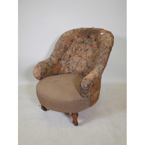 1176 - A Victorian tub shaped button back easy chair, raised on turned supports