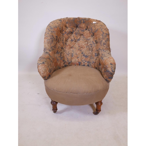 1176 - A Victorian tub shaped button back easy chair, raised on turned supports