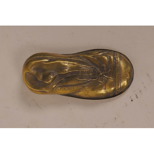 22 - A novelty brass vesta case in the form of a lady's shoe within a shoe, 3