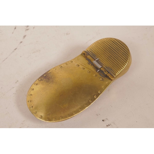 22 - A novelty brass vesta case in the form of a lady's shoe within a shoe, 3