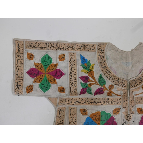 62 - An Islamic linen tunic, decorated with polychrome patterns and all over calligraphy, 42