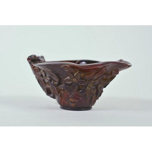 15 - A Chinese faux horn libation cup with carved floral decoration, chased mark to base, 4½