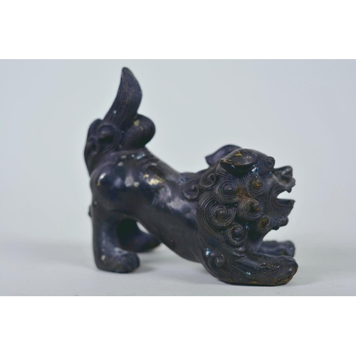 19 - A pair of Oriental patinated bronze figures of fo dogs, 6