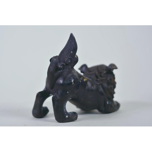 19 - A pair of Oriental patinated bronze figures of fo dogs, 6