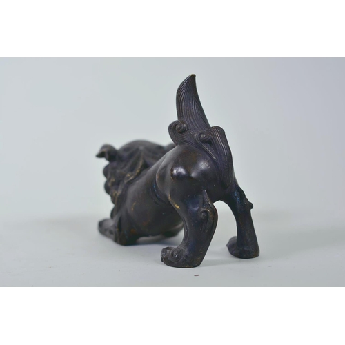 19 - A pair of Oriental patinated bronze figures of fo dogs, 6