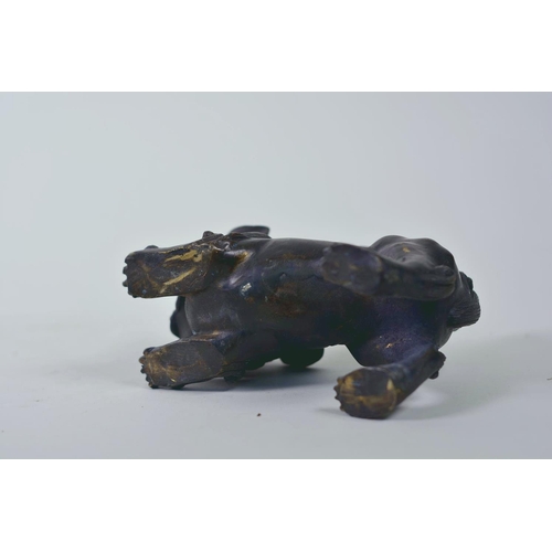 19 - A pair of Oriental patinated bronze figures of fo dogs, 6