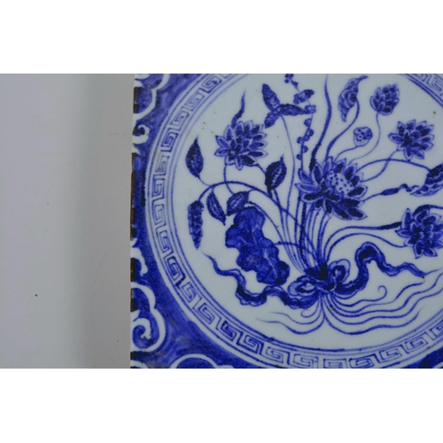 20 - A Chinese blue and white porcelain tile decorated with flowers, 8