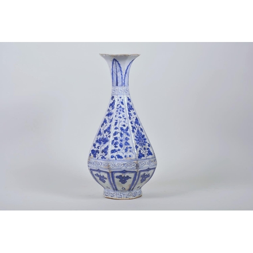 23 - A Chinese Ming style blue and white pottery pear shaped vase decorated with flowers, 12