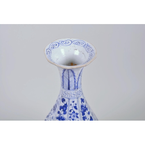 23 - A Chinese Ming style blue and white pottery pear shaped vase decorated with flowers, 12