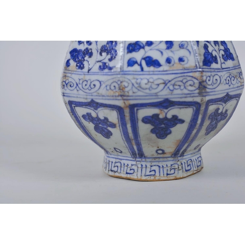 23 - A Chinese Ming style blue and white pottery pear shaped vase decorated with flowers, 12