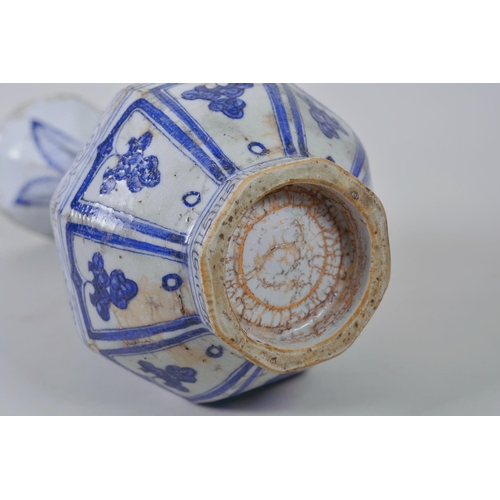 23 - A Chinese Ming style blue and white pottery pear shaped vase decorated with flowers, 12