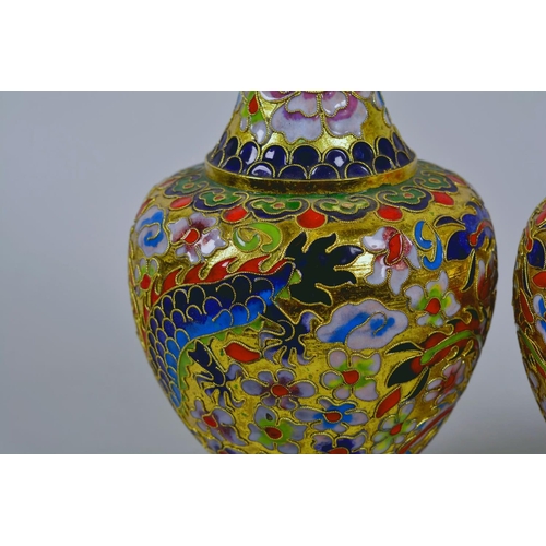 24 - A pair of Oriental cloisonné vases decorated with dragons, 8