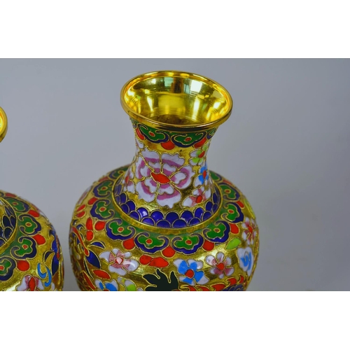 24 - A pair of Oriental cloisonné vases decorated with dragons, 8