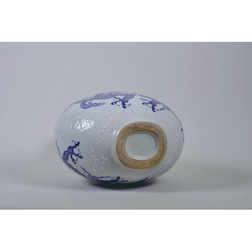 28 - A Chinese blue and white moon flask with dragon decoration, 6 character mark to side, 12½