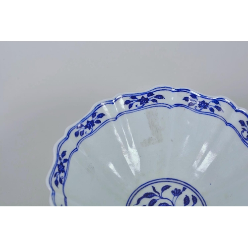 38 - A Chinese blue and white porcelain bowl with a lobed rim and dragon decoration, 6 character mark to ... 