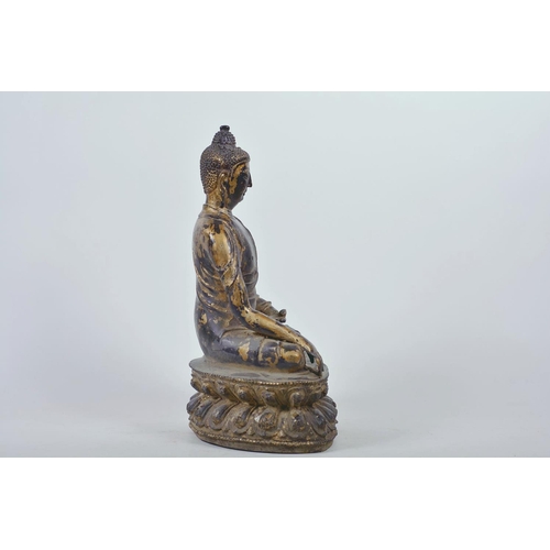 47 - A Chinese patinated bronze figure of Buddha seated in meditation, 12