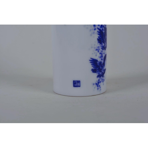 50 - A Chinese blue and white porcelain cylinder vase/brush pot decorated with birds in flight, seal mark... 