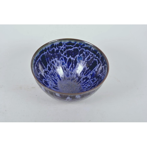 52 - A Chinese Jian kiln bowl with high fired blue drip glaze, impressed character mark to base, 5¼