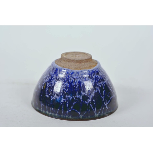 52 - A Chinese Jian kiln bowl with high fired blue drip glaze, impressed character mark to base, 5¼