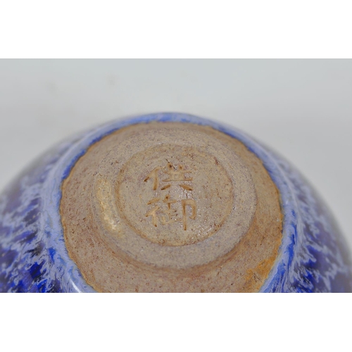 52 - A Chinese Jian kiln bowl with high fired blue drip glaze, impressed character mark to base, 5¼