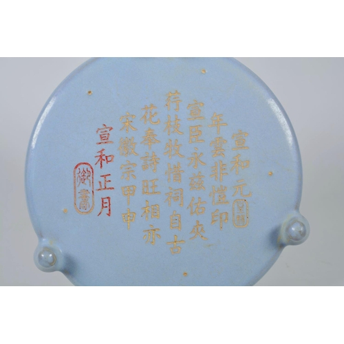 58 - A Chinese Song style dish on tripod feet with a Ru ware glaze, engraved and gilt character inscripti... 