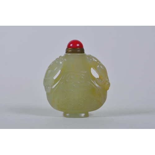 61 - A Chinese celadon jade snuff bottle with two carved kylin handles, 2½