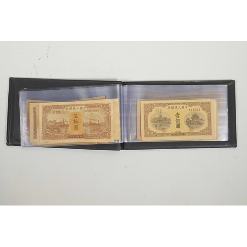 10 - A wallet of Chinese facsimile (replica) banknotes of assorted denominations, 8½