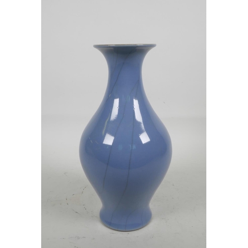 13 - A Chinese porcelain blue glazed vase with crackle glaze decoration, 9½